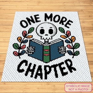 May include: White rectangular rug with a pixelated design featuring a skull reading a book. The text "ONE MORE CHAPTER" is above and below the skull. Colorful leaves are on either side of the skull. The bottom right corner has the text "SYMBOLIC IMAGE, NOT A PHOTO!"