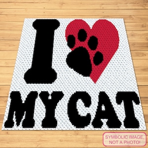 May include: A white crochet blanket with black text that reads "I love my cat" and a red heart with a black paw print inside.