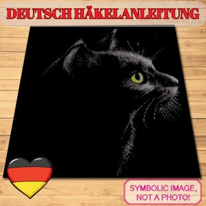 May include: Black cat illustration with bright green eyes, set against a black background. The image includes the text "DEUTSCH HÄKELANLEITUNG" at the top and a German flag heart at the bottom left. The bottom right corner reads "SYMBOLIC IMAGE, NOT A PHOTO!"