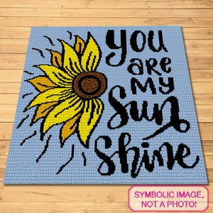Op de afbeelding: Een haakpatroon met een zonnebloem en de tekst "You are my sunshine".