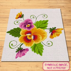 Può includere: Uno schema di punto croce con un bouquet di violette gialle, viola e arancioni con foglie e viti verdi.