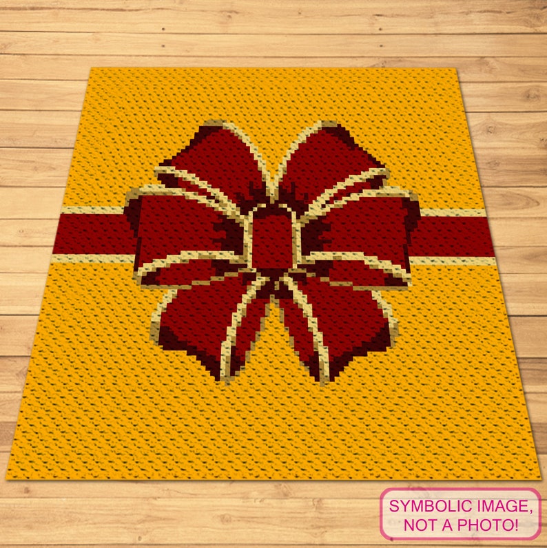 May include: A yellow crochet square with a red bow and a red ribbon. The bow has a gold outline. "SYMBOLIC IMAGE, NOT A PHOTO!" is written in white text on a pink rectangle at the bottom of the image.