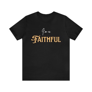 May include: Black t-shirt with the text "I'm a Faithful" in gold lettering.