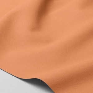 Softshell Muskmelon - Waterproof fabric for clothing | Orange Softshell fabric