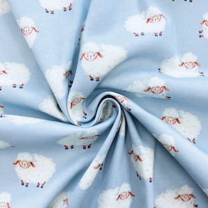 Cotton Jersey | Cotton knit fabric | Children&#39;s Fabric | Cotton jersey fabric kid | White sheeps on a pastel blue background