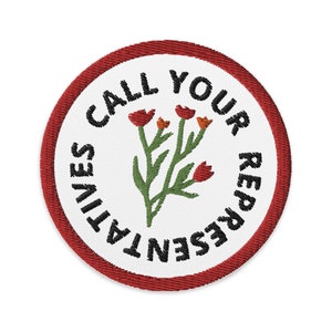 Puede incluir: Un parche bordado rojo y blanco con el texto "Call Your Representatives" y una imagen estilizada de una flor con flores rojas.