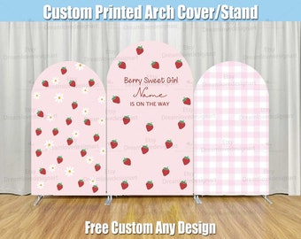 May include: A pink and white arch cover with a strawberry and daisy pattern. The middle panel has the text "Berry Sweet Girl Name Is On The Way".