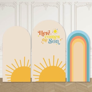 May include: Three arched panels with a retro theme. The panels feature a sun graphic and the text "Here Comes the Son." One panel has a rainbow design. The colour palette includes yellow, orange, blue, and beige.