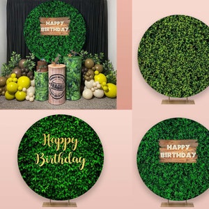 May include: Three green round backdrops with the text "Happy Birthday" on a wooden sign. The backdrops are made of artificial greenery and are perfect for a birthday party.