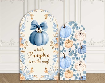 May include: Two arched backdrops featuring a cream background with blue and orange watercolor pumpkins, foliage, and a blue bow. The larger backdrop displays the text 'a little Pumpkin is on the way!' while the smaller one has a repeating pumpkin pattern.