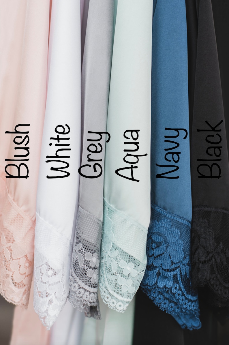 May include: Six different colors of fabric swatches with lace trim. The colors are blush, white, grey, aqua, navy, and black.