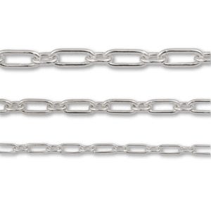 May include: Three horizontal silver-toned metal chains arranged in parallel rows. Each chain consists of a series of uniform, elongated rectangular links with rounded edges, creating a consistent and repeating pattern across all three strands.