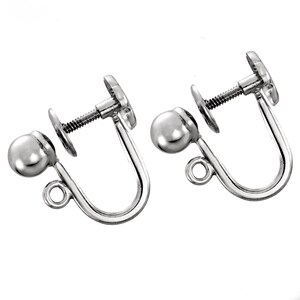 May include: A pair of silver-toned earring backs with a screw-on design and a small ball on the end.