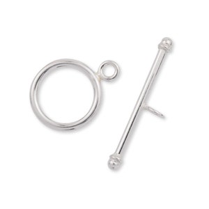 May include: Silver toggle clasp with a round ring and a straight bar with rounded ends.