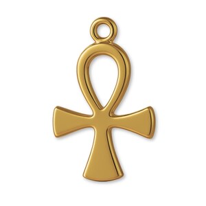 May include: A polished gold-tone metal ankh pendant featuring a smooth, reflective surface and a rounded loop at the top for attachment. The cross-shaped charm has a classic Egyptian symbol design with a teardrop-shaped top and flared arms.
