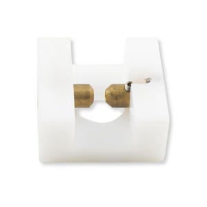 May include: A white U-shaped plastic block featuring two opposing brass-colored metal cylindrical pins positioned in the center gap. The pins are aligned horizontally, and a small metal spring is visible near the right-hand pin attachment point.