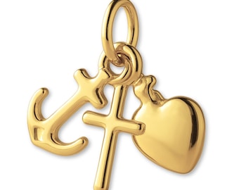 May include: A gold-toned metal charm featuring three distinct symbols suspended from a single circular jump ring: a nautical anchor, a simple Latin cross, and a smooth, rounded heart shape. The metal has a polished, reflective finish.