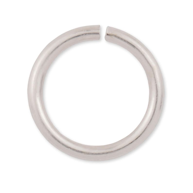 May include: Silver jump ring, a circular metal ring with a gap, used for connecting jewelry components.