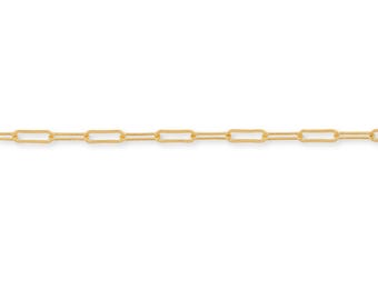 May include: A gold-toned chain necklace featuring elongated, rectangular paperclip-style links connected in a continuous horizontal line. The metal surface has a polished finish, creating a uniform and repeating pattern across the entire length of the chain.