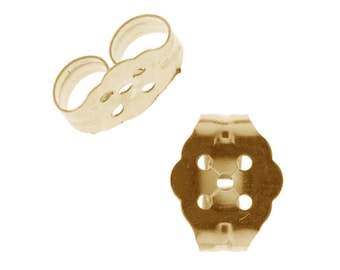May include: Two gold-tone earring backs. One is a butterfly shape with a hole in the centre and four smaller holes around it. The other is a curved shape with a hole in the centre and two smaller holes on each side.