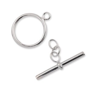 May include: Silver-toned toggle clasp with a round loop and a straight bar. The clasp is designed for jewellery making.
