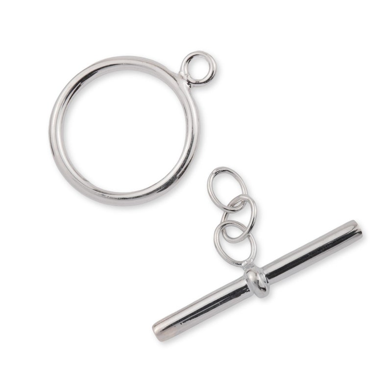 May include: Silver-toned toggle clasp with a round loop and a straight bar. The clasp is designed for jewelry making.