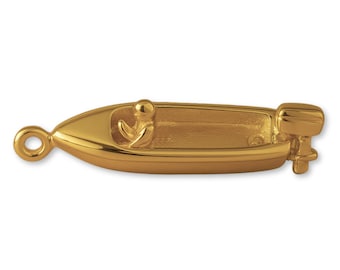 May include: A polished gold-tone metal charm shaped like a small motorboat. The charm features a smooth hull, a single seat with a stylized figure inside, and an outboard motor attached to the stern. A circular loop is fixed to the bow.