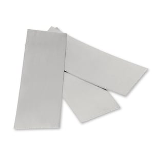 May include: Three white rectangular pieces of paper, folded in half, with a slightly rough texture.