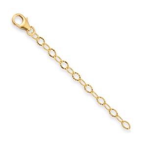 Pode incluir: Um extensor de corrente de ouro com um fecho de lagosta. A corrente tem aproximadamente 5 cm de comprimento e apresenta um design delicado de elos ovais.