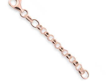 May include: A rose gold-toned metal chain extender featuring a series of circular links and a lobster claw clasp at one end. The chain is designed to add length to jewelry pieces and has a polished, reflective surface throughout the entire length.
