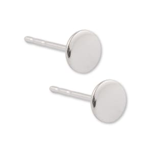 May include: A pair of silver stud earrings with round, flat fronts.