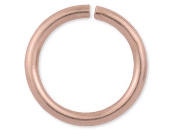 May include: A rose gold jump ring, a type of jewelry finding used for connecting jewelry components.