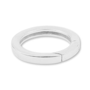 May include: A silver-colored, circular clasp with a hinged design. The clasp is made of a smooth, reflective metal and has a flat, rectangular profile. The clasp is designed to open and close, likely for use with jewelry or accessories.