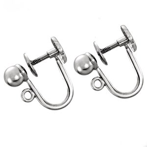 May include: A pair of silver-toned earring backs with a screw-on design and a small ball on the end.