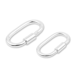 May include: Two silver-colored oval carabiner clips. One clip is open, and the other is closed with a threaded barrel. The clips are made of a shiny metal and are set against a white background.