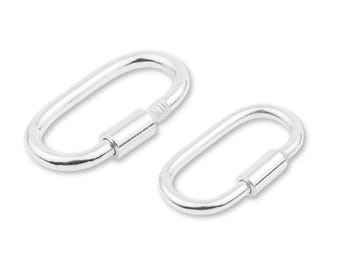 May include: Two silver-colored oval carabiner clips. One clip is open, and the other is closed with a threaded barrel. The clips are made of a shiny metal and are set against a white background.