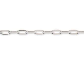 May include: A silver-toned metal chain featuring a series of uniform, elongated oval links connected in a continuous horizontal line. The links have a smooth, polished surface that reflects light, creating a bright, metallic appearance.