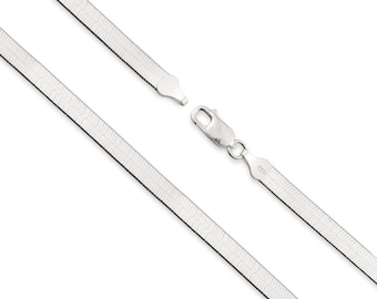 May include: A silver-toned herringbone chain necklace featuring a flat, flexible link design with a polished metallic finish. The necklace includes a secure lobster claw clasp mechanism that connects the two ends of the chain together.