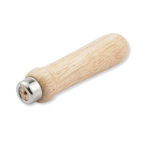 May include: A cylindrical wooden handle featuring a light tan natural wood grain finish and a smooth, rounded end. The opposite end is capped with a polished silver-colored metal ferrule that has a small, circular opening in the center.