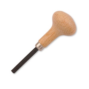 May include: A wooden handled metal tool with a black metal blade. The tool is used for carving and shaping metal.