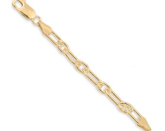 May include: A gold chain bracelet featuring elongated oval links connected by smaller round links. The bracelet is finished with a polished gold lobster claw clasp at one end and a matching jump ring at the other end, showcasing a bright metallic finish.