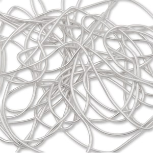May include: A close-up of a silver snake chain, a type of jewelry chain, made of small, interconnected rings. The chain is coiled and tangled, showing its flexibility and smooth texture.