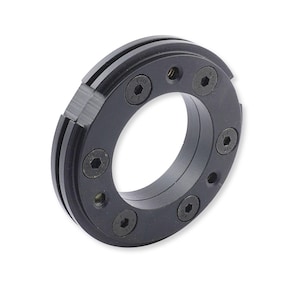 May include: A circular black metal component featuring a central opening and a series of evenly spaced hexagonal bolts secured around its perimeter. The outer edge displays a distinct grooved channel, and the surface has a matte finish.
