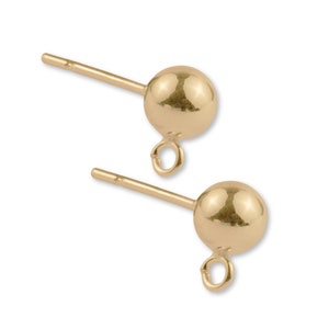 May include: A pair of gold-toned earring posts with a small loop at the bottom of each post. The posts are round and have a smooth finish.