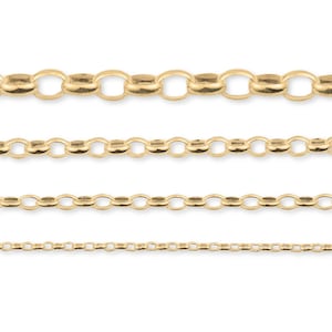 May include: Four gold chains of different thicknesses, each with a classic cable link design. The chains are arranged in a vertical stack, with the thickest chain at the top and the thinnest chain at the bottom.
