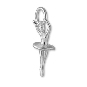 May include: A silver-colored charm in the shape of a ballerina. The charm features a dancer with arms raised, wearing a tutu. The charm has a loop at the top for attaching to a necklace or bracelet.