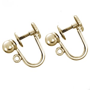 May include: A pair of gold-tone screw-back earring findings with a ball-shaped post.