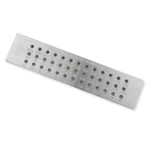 May include: A rectangular silver-colored tungsten carbide drawplate featuring multiple rows of circular holes of varying sizes. Each hole is labeled with a numerical measurement in millimeters. The text TUNGSTEN CARBIDE DRAWPLATE is engraved on the surface.