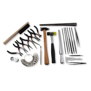 May include: A set of jewelry making tools including pliers, a hammer, a ring mandrel, files, tweezers, a magnifying glass, and a ring sizer.