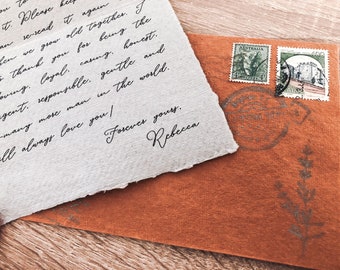 May include: A handwritten letter on white paper with a brown envelope and three stamps. The letter reads, "you I it. Please can se-read it again when we grow old together. I to thank you for being the loving. Coyal, casing, honest. ligent, responsible. gentle and y-many more man in the world. will always love you! Forever yours. Rebecca". The stamps are from Australia and Italy.
